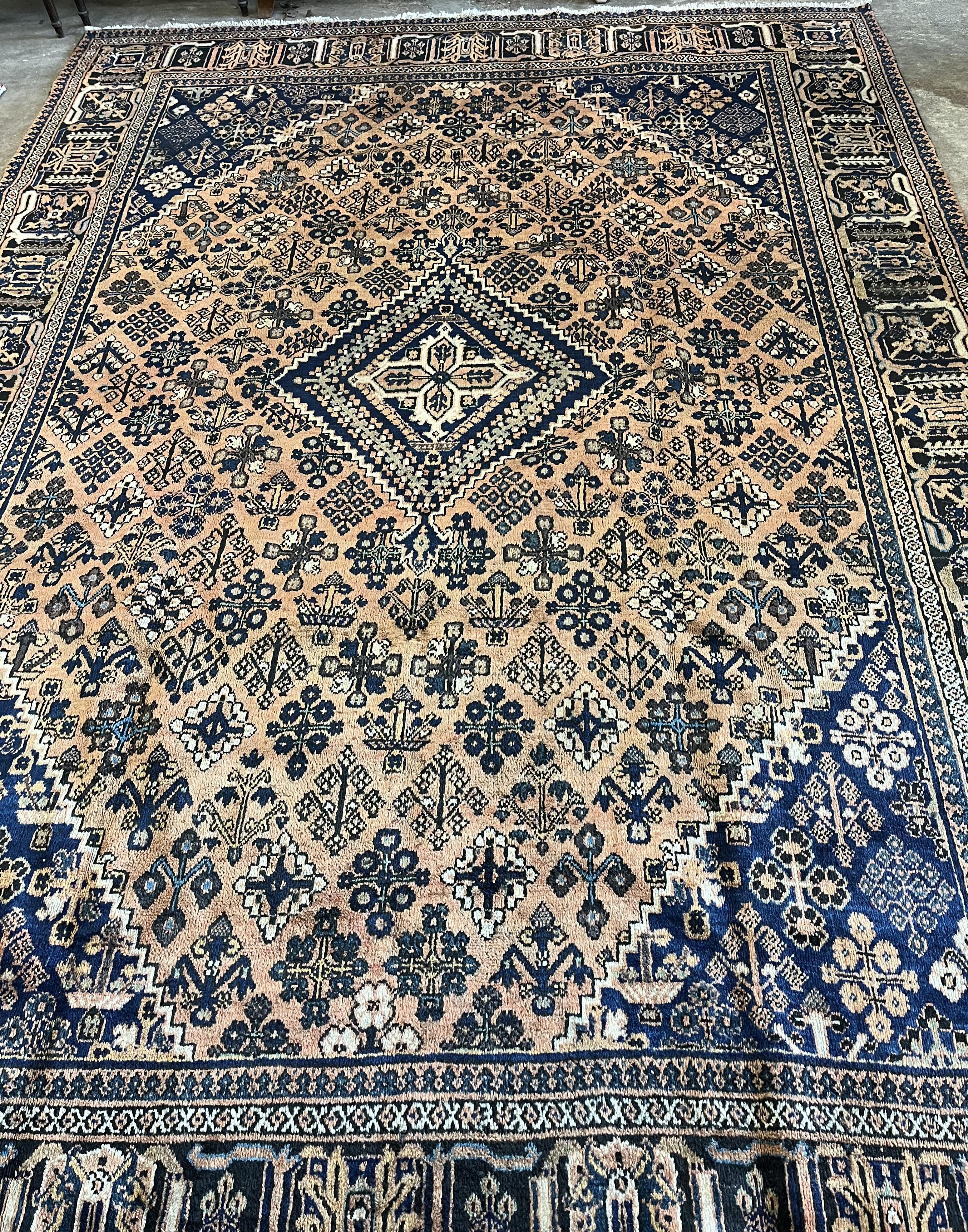 A Joshagan peach ground carpet, 342 x 250. Condition - good